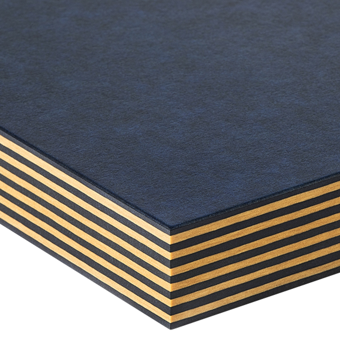 Figure 11 — Reference photograph of Richlite phenolic-paper composite stock — the Adam-Savage-exact body material for the box. Richlite is about 65% FSC-certified paper, 35% phenolic resin by weight; it machin…